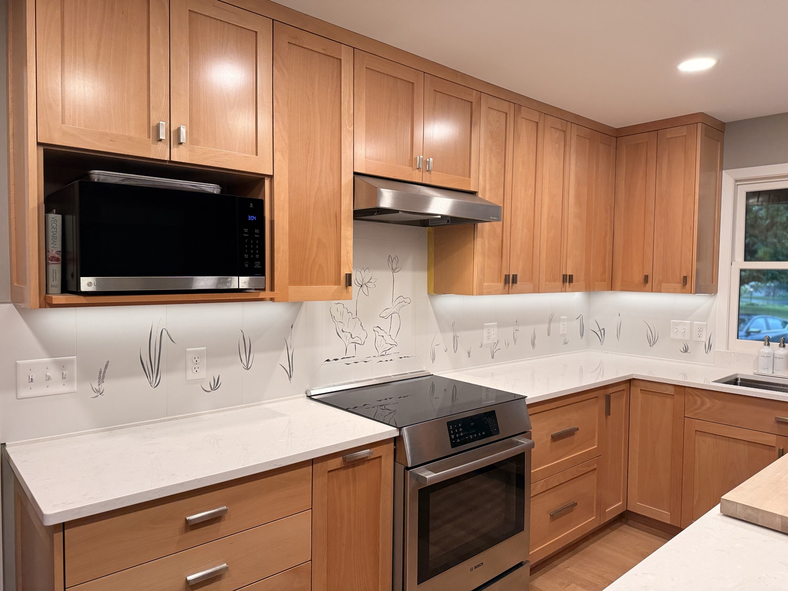 Finished kitchen with custom illustrated botanical backsplash